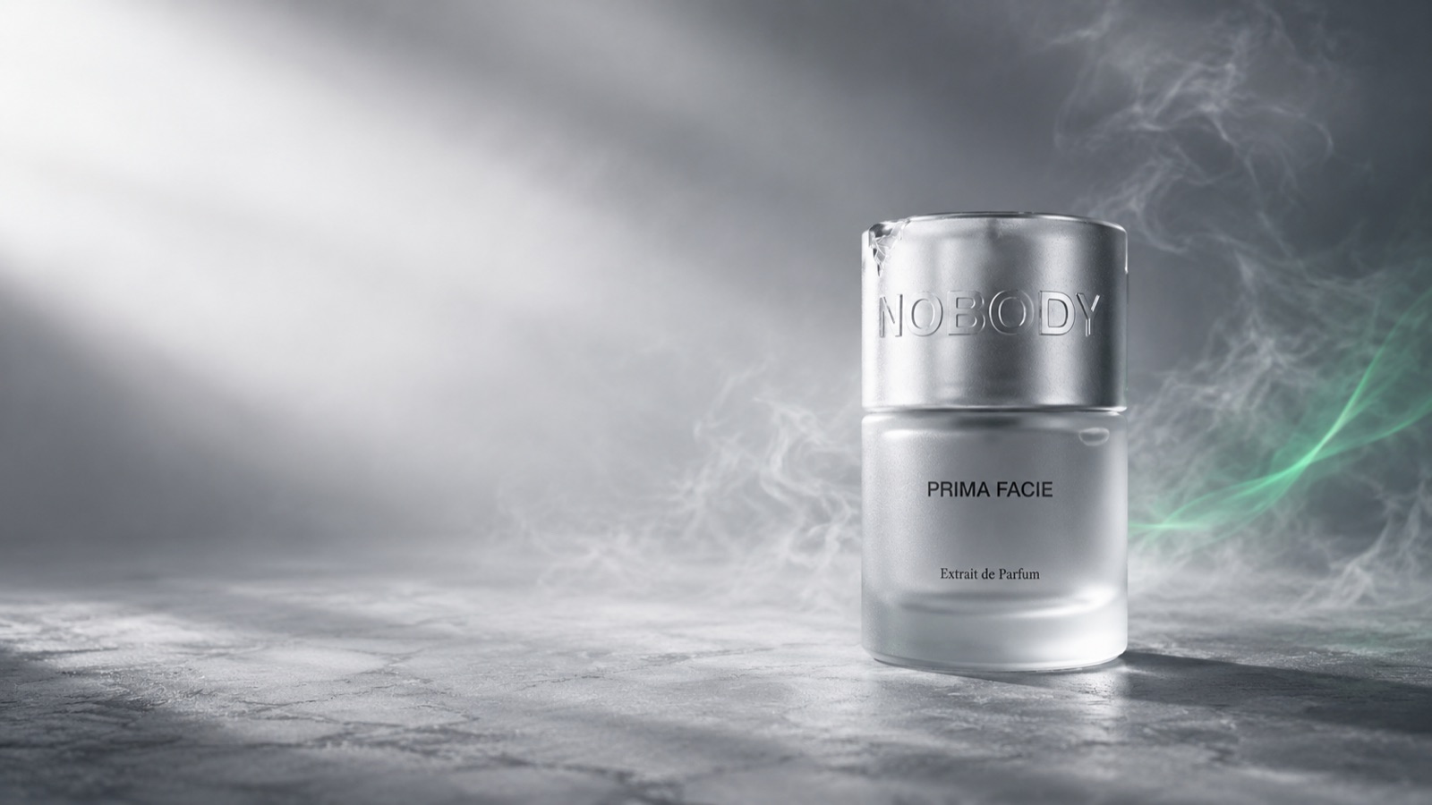 Prima Facie by NBDY — frosted chrome bottle in soft mist with a green light trail